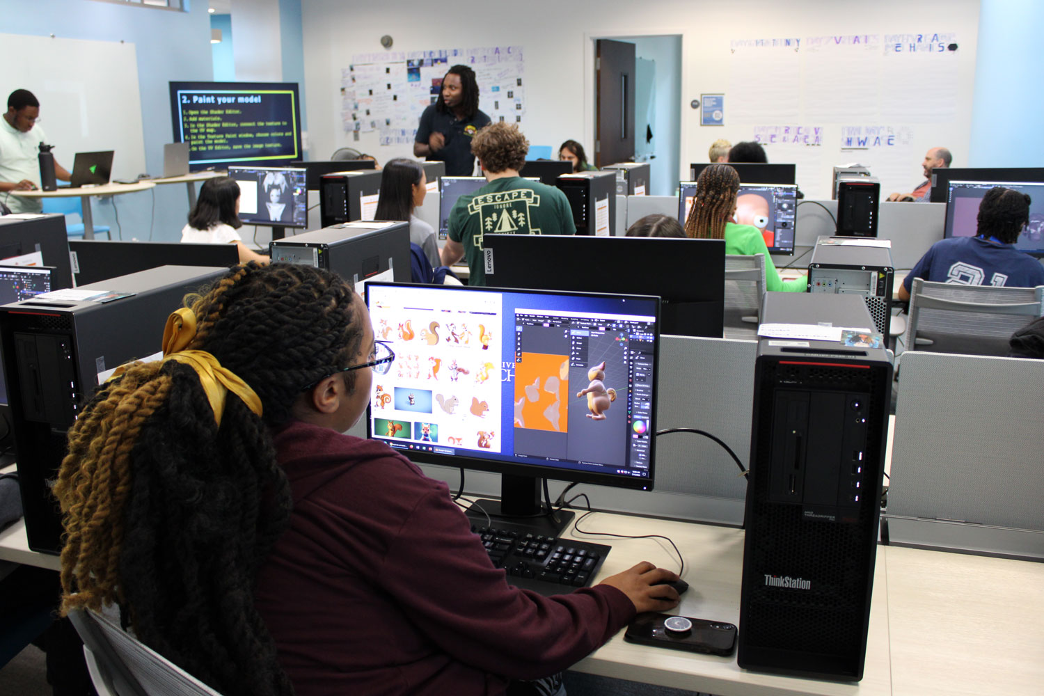 A student works on creating 3D model of a squirrel in Blender.