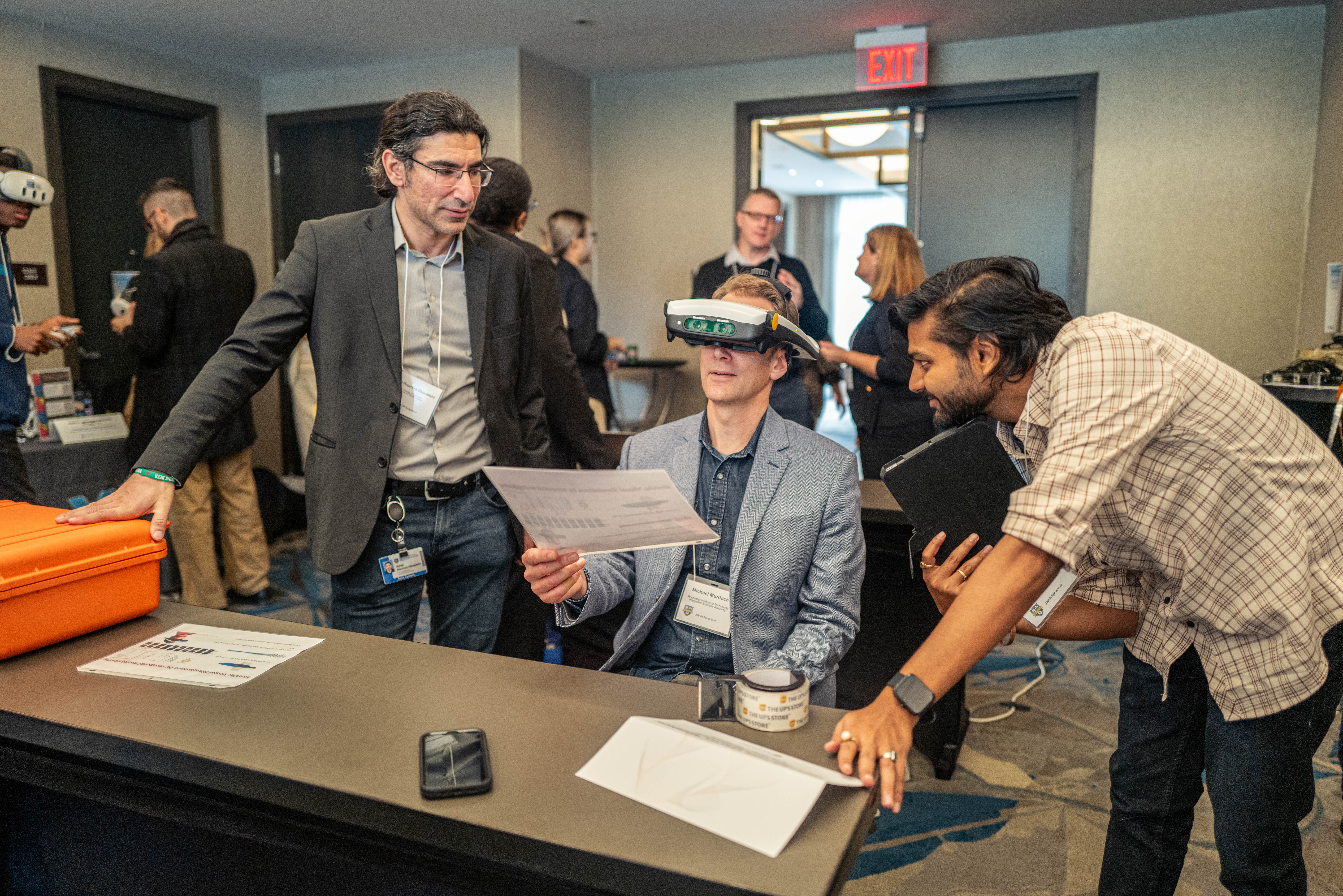 Person tests headset at AR/VR symposium.