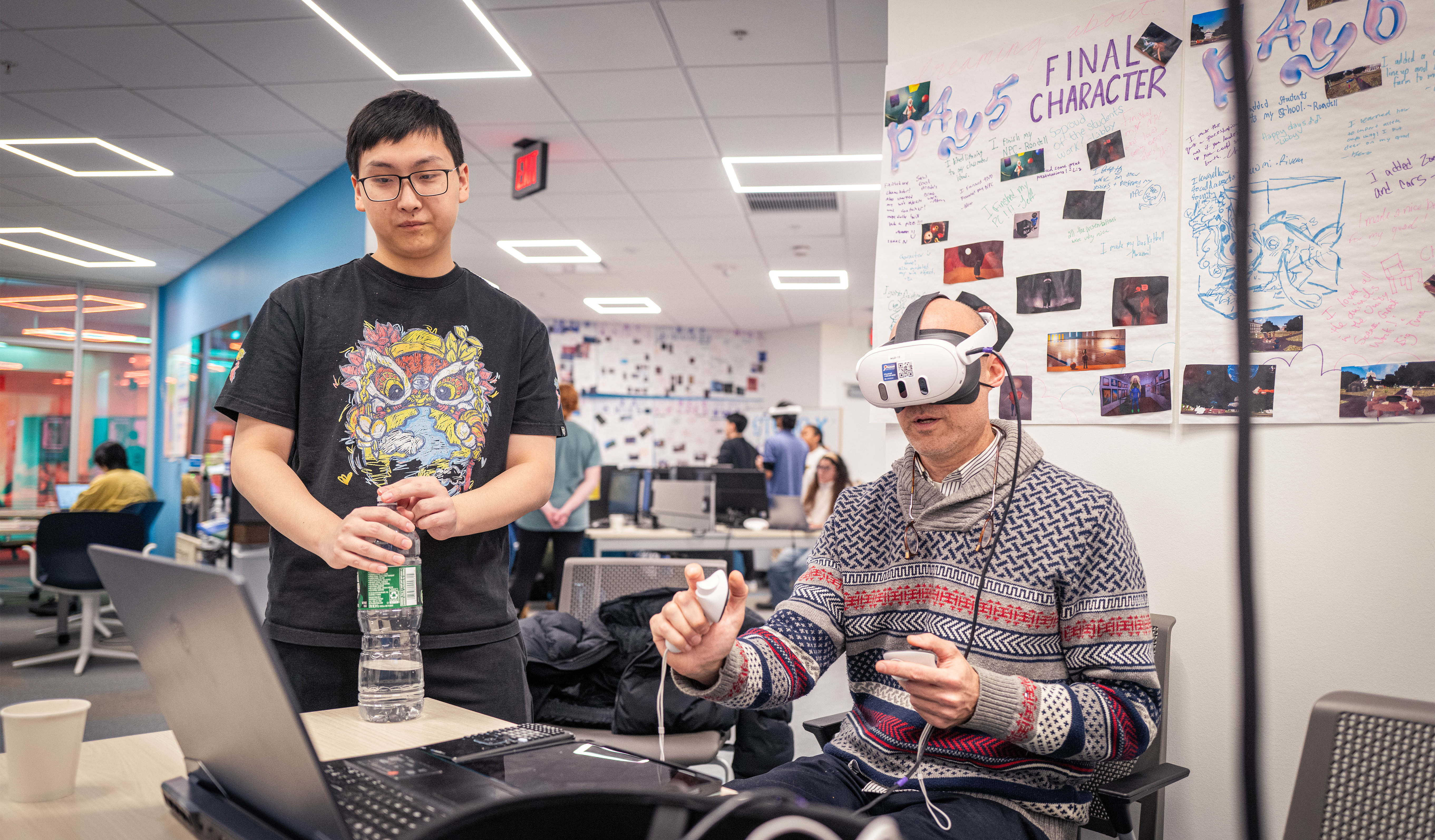Student teaching person how to use Metaquest headset.