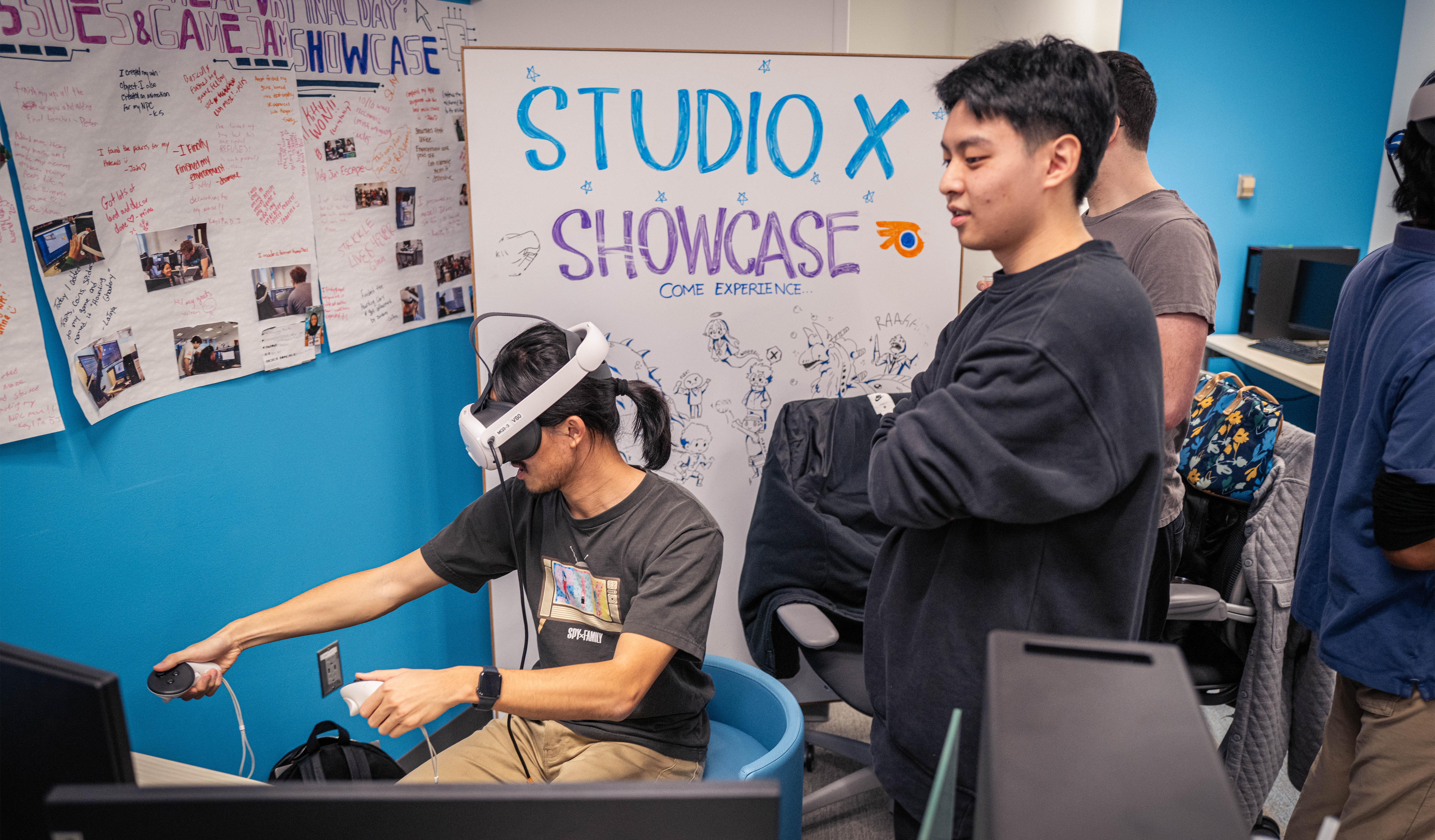 Student teaching person how to use Metaquest headset.